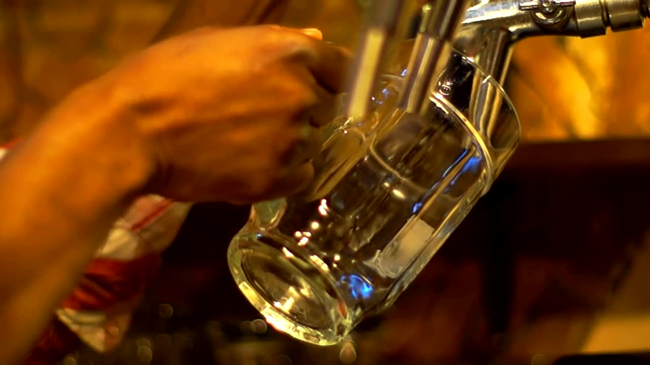 Stock Video Bartender Serving Beer On A Beer Mug Live Wallpaper For PC