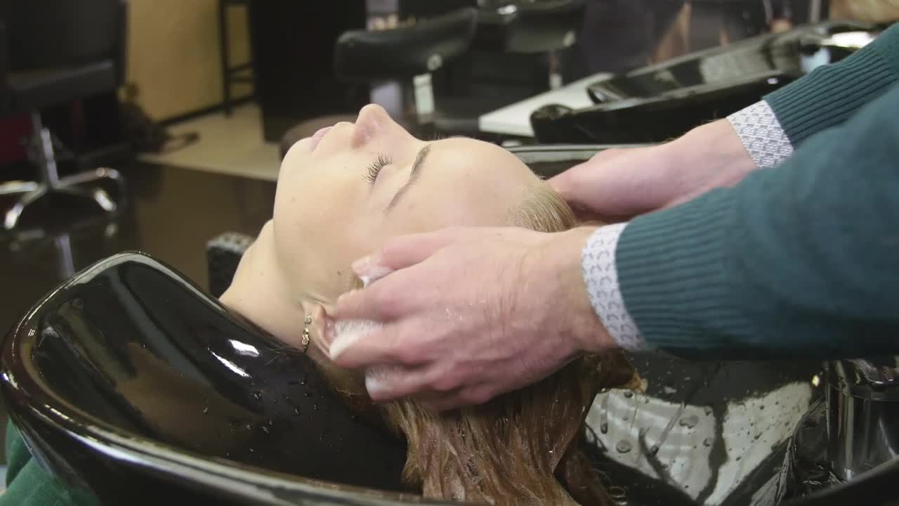 Stock Video Barber Washing Hair In A Sink Live Wallpaper For PC