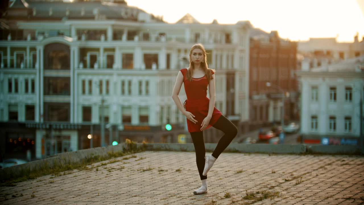 Stock Video Ballet Dancer Doing A Position High Up In A City Live Wallpaper For PC