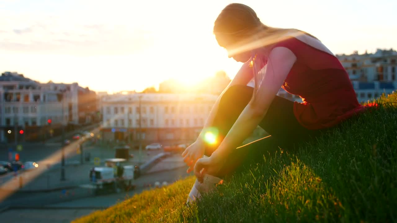 Stock Video Ballet Dancer Adjusting Her Slippers On The Grass Live Wallpaper For PC
