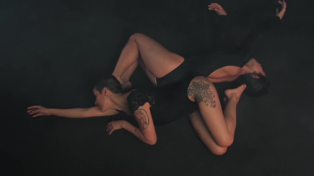 Stock Video Ballerinas Lying On Their Backs Moving Their Hands Gently Live Wallpaper For PC