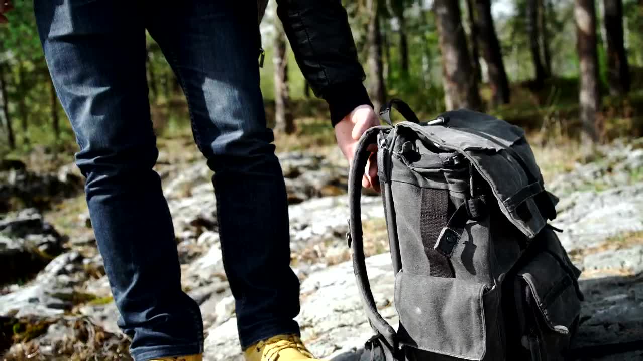 Stock Video Backpacker Walks Across Rocky Forest Towards River Live Wallpaper For PC