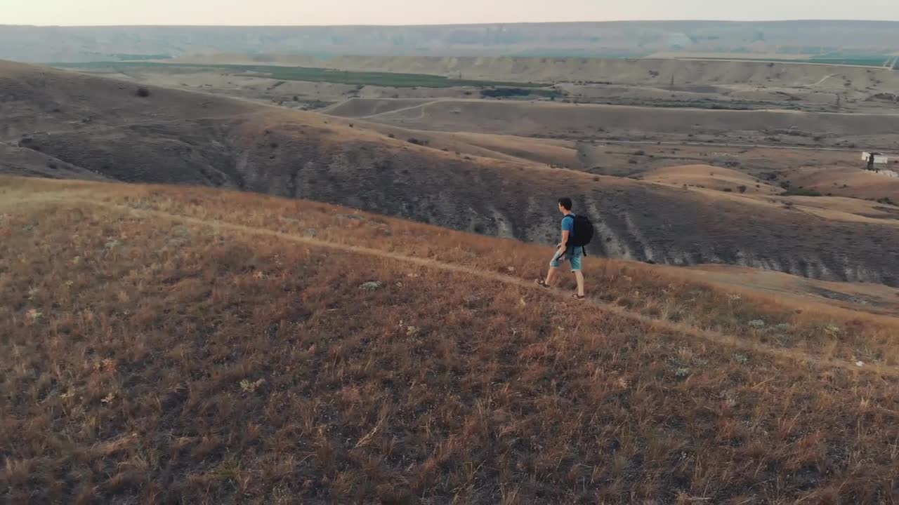 Stock Video Backpacker Hiking In The Hills Aerial Shot Live Wallpaper For PC