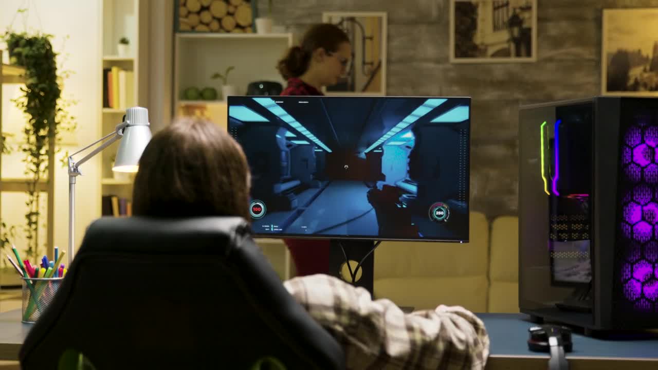 Stock Video Back View Of Man Video Gaming At Home Live Wallpaper For PC