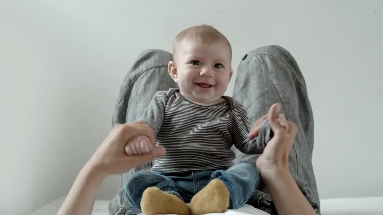 Stock Video Baby On The Belly Of His Mother Plays And Smiles Live Wallpaper For PC