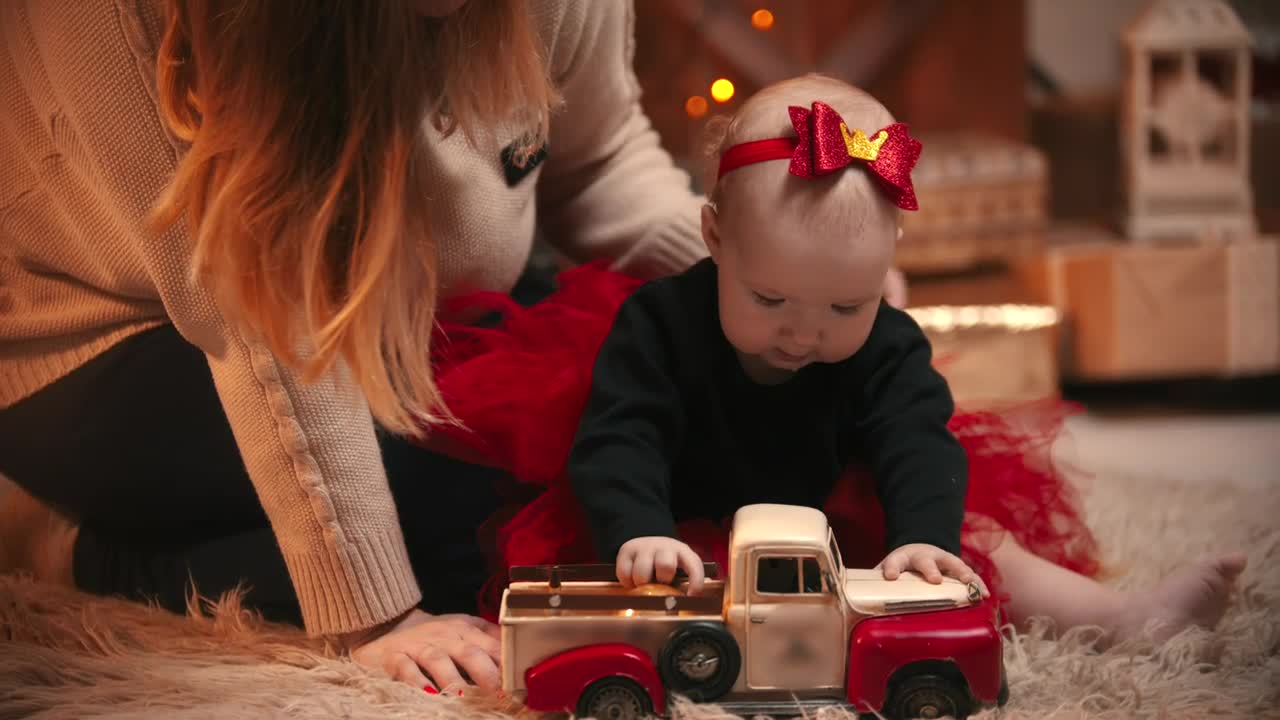 Stock Video Baby Girl Next To Her Mother Playing On A Carpet Live Wallpaper For PC