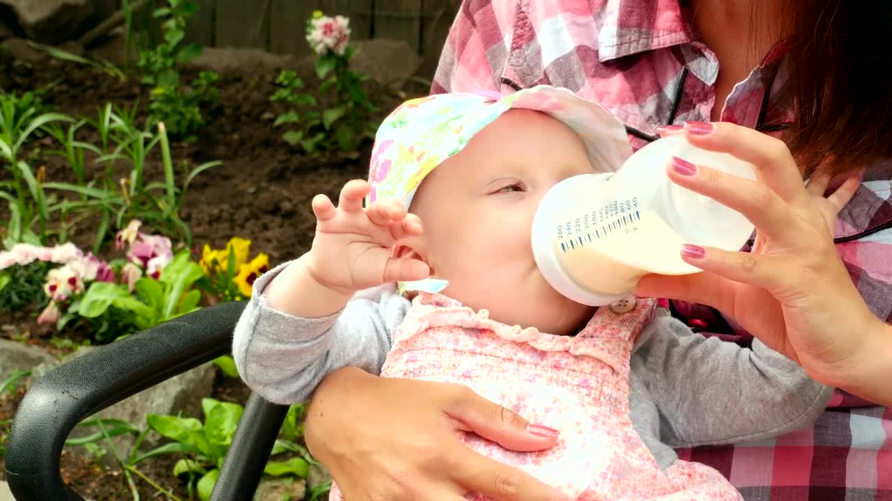 Stock Video Baby Girl Drinking Milk From A Baby Bottle Live Wallpaper For PC