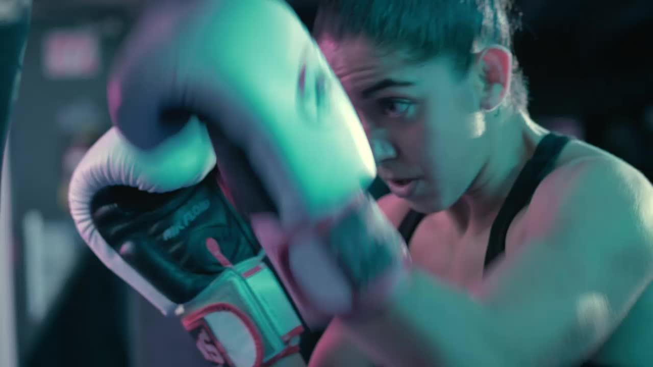 Stock Video Athletic Woman Training With A Punching Bag Live Wallpaper For PC