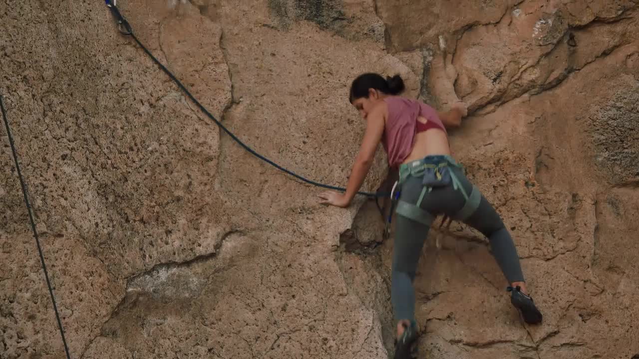 Stock Video Athletic Female Mountaineer Climbing A Rocky Mountain Live Wallpaper For PC