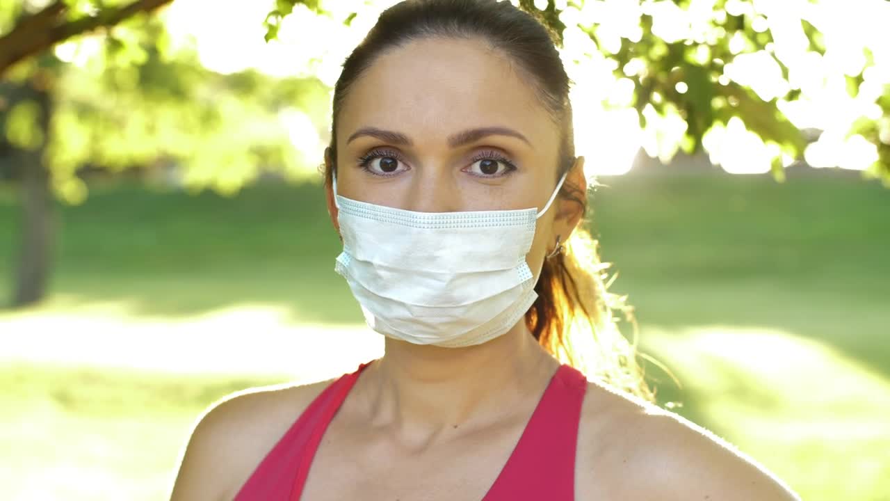 Stock Video Athlete Woman Wearing Mask In Park Portrait Live Wallpaper For PC
