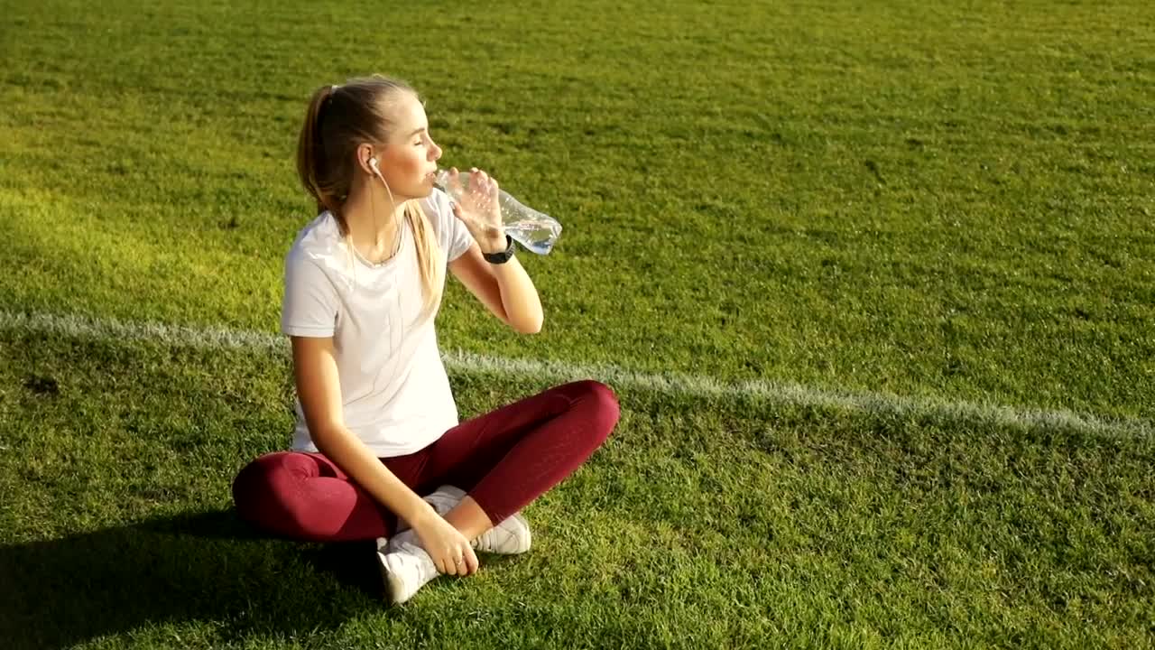 Stock Video Athlete Woman Drinking Water And Resting Live Wallpaper For PC