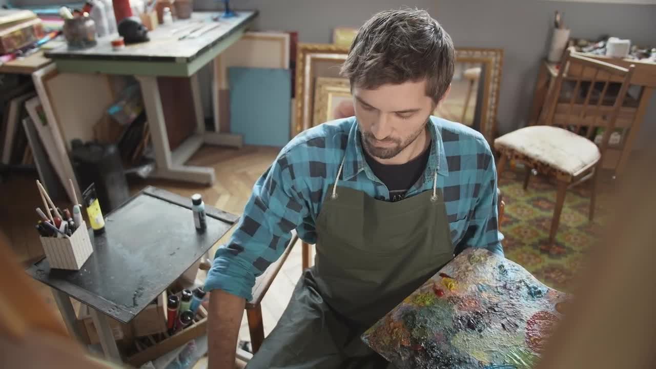 Stock Video Artist With Palette Thinks About Ideas While Looking At Canvas Live Wallpaper For PC