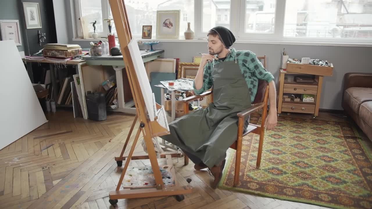 Stock Video Artist Stares At Canvas Sitting In Art Studio Live Wallpaper For PC