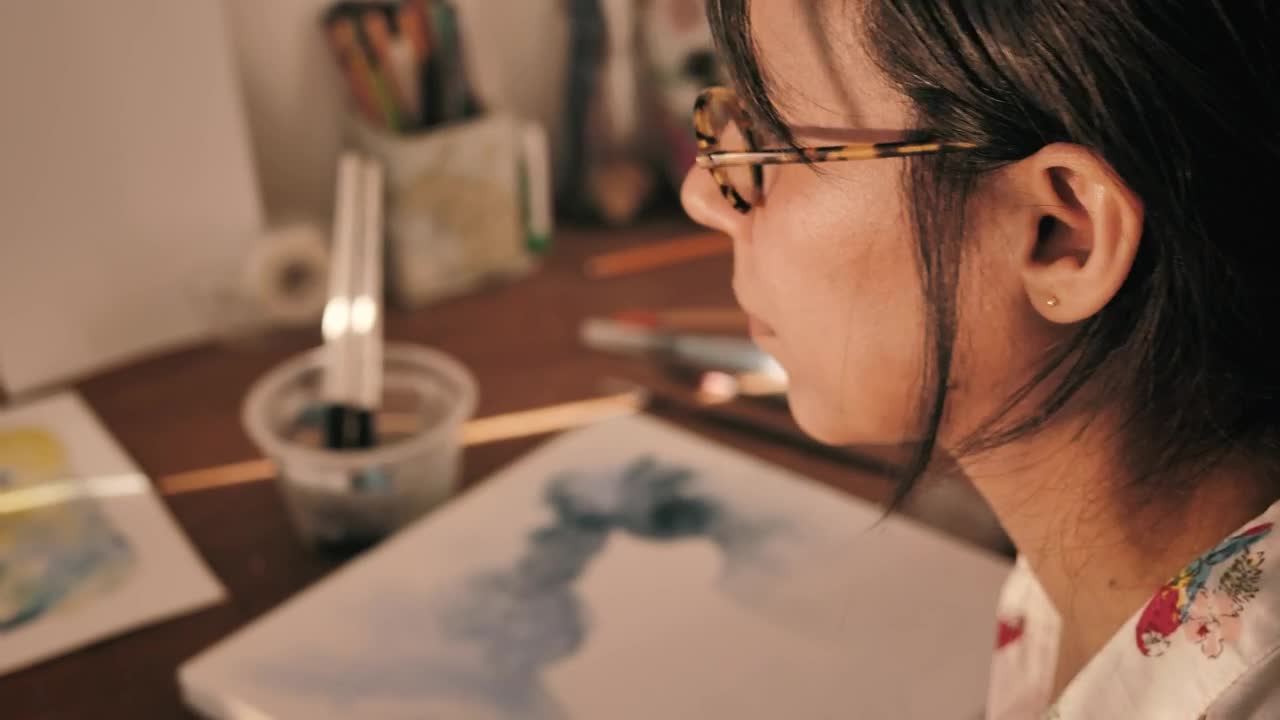 Stock Video Artist Soaking Her Paintbrush To Paint With Watercolors Live Wallpaper For PC