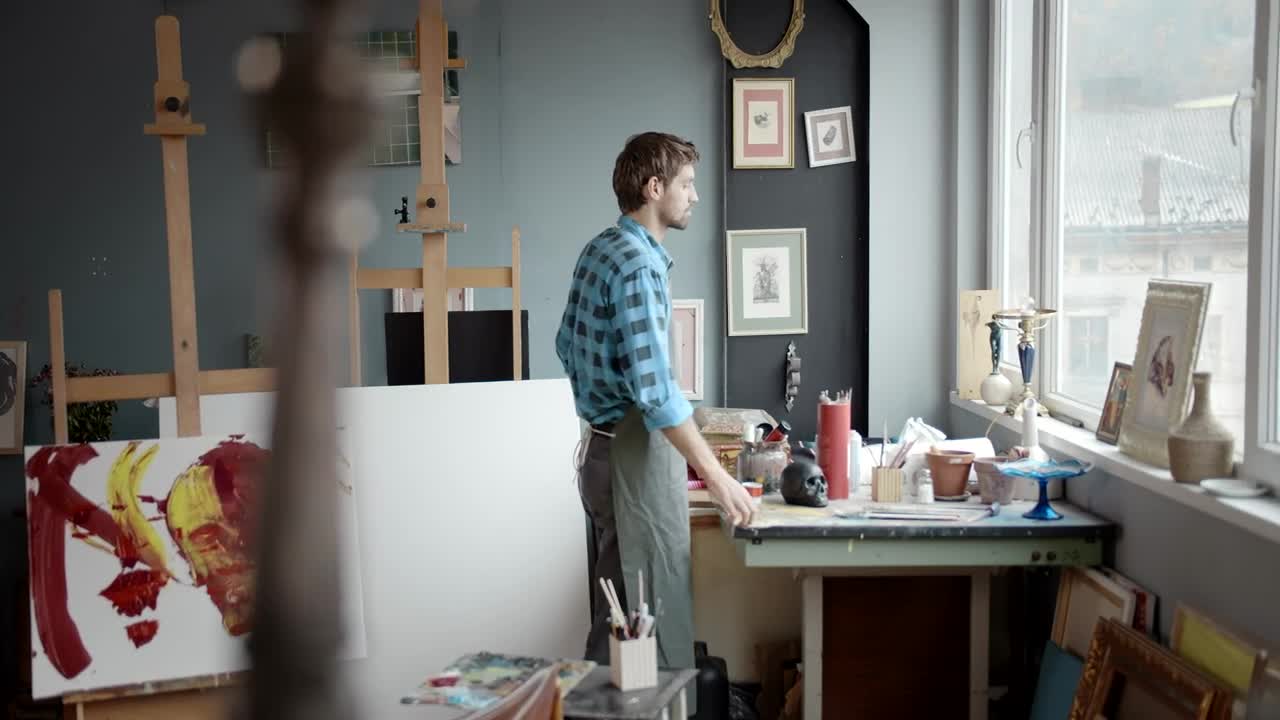 Stock Video Artist Gazes Out Window In Painting Studio Live Wallpaper For PC