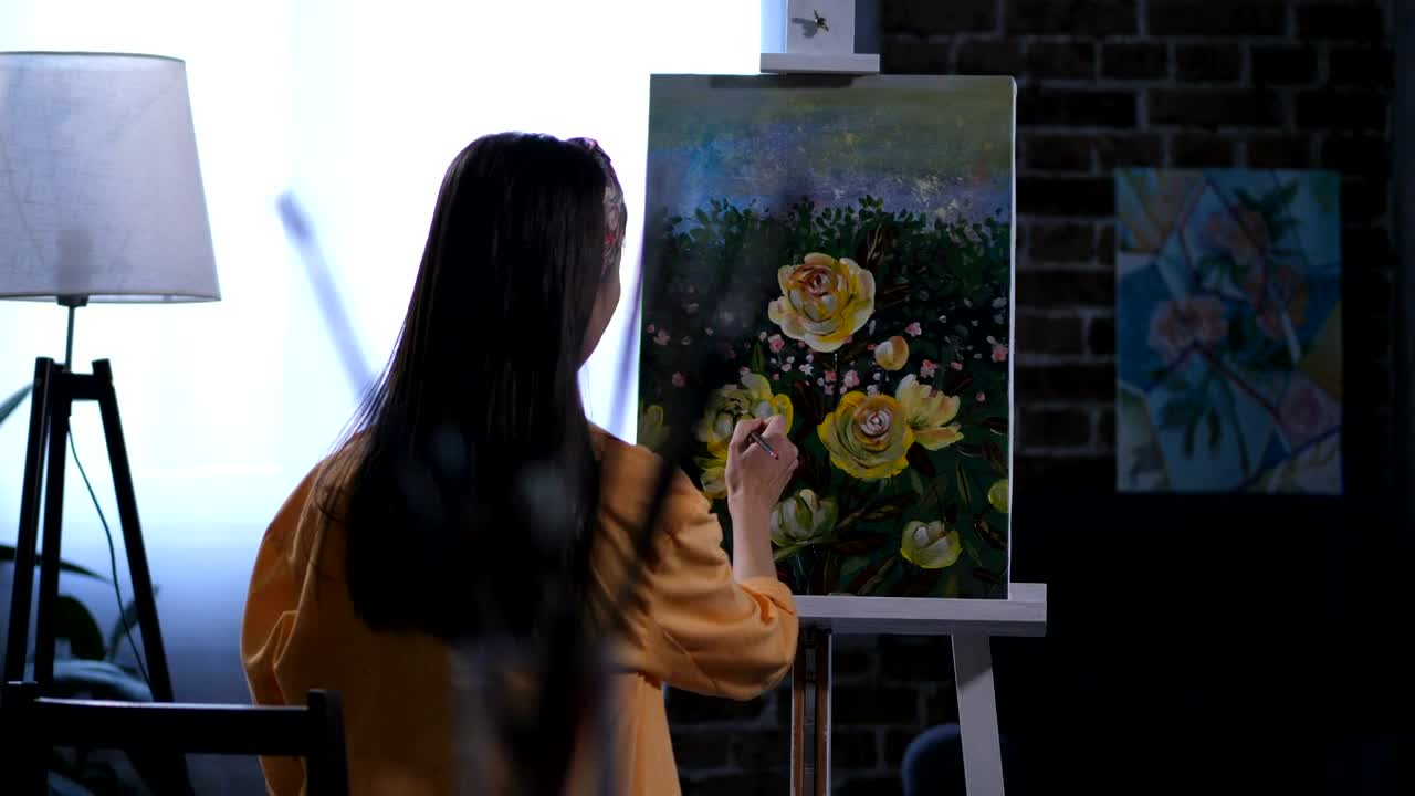 Stock Video Artist Adding The Final Details To Her Painting Live Wallpaper For PC
