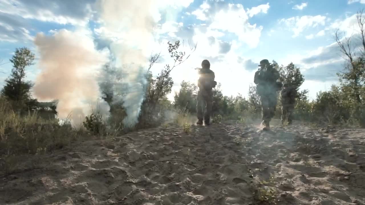 Stock Video Armed Soldiers Walking On The Field Live Wallpaper For PC