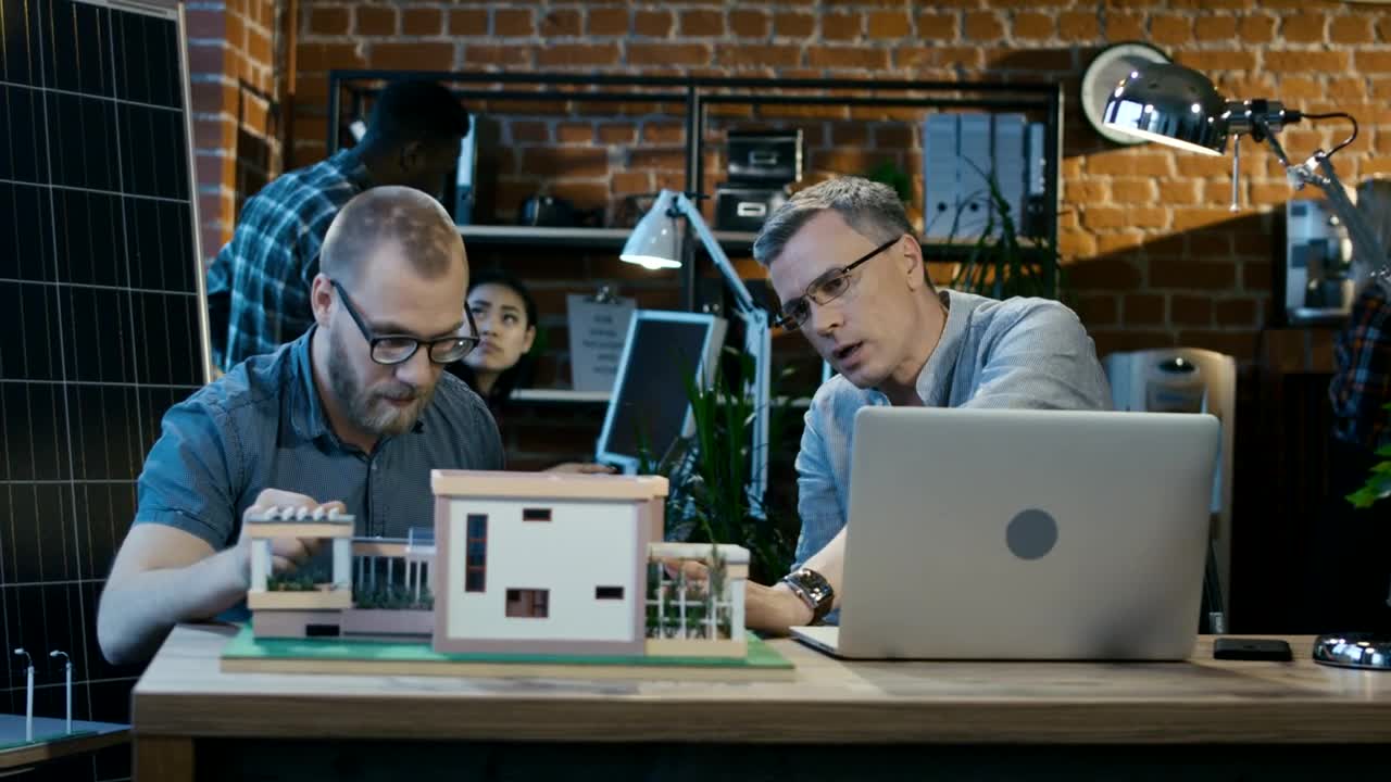 Stock Video Architects Working On A House Model In The Office Live Wallpaper For PC