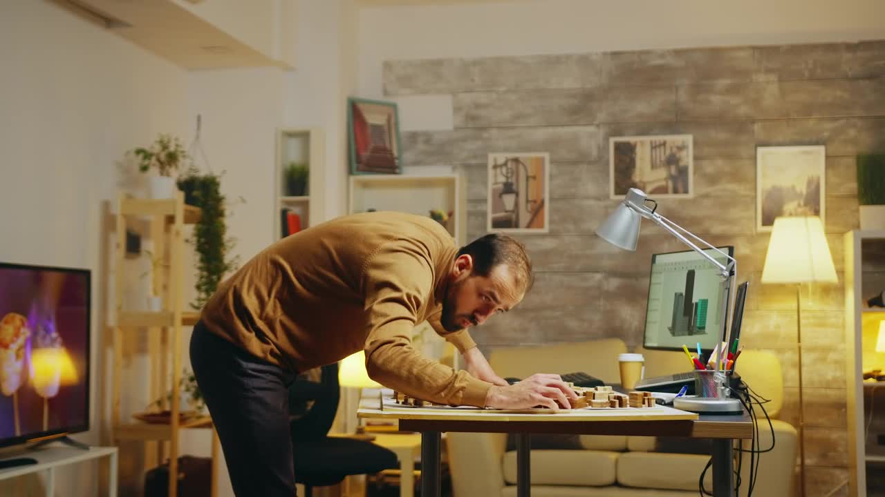 Stock Video Architect Working On A Model At An Office Live Wallpaper For PC