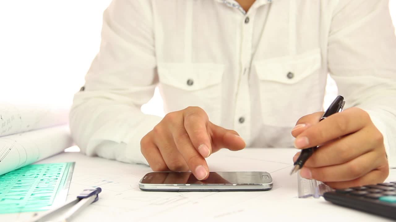 Stock Video Architect Using His Smartphone While Working Live Wallpaper For PC