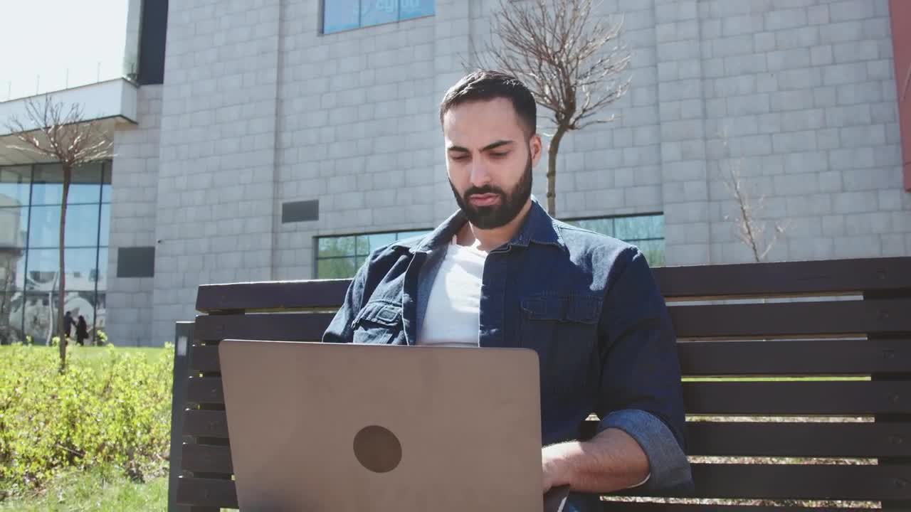 Stock Video Arab Man Works On Laptop Outside Office Building Live Wallpaper For PC