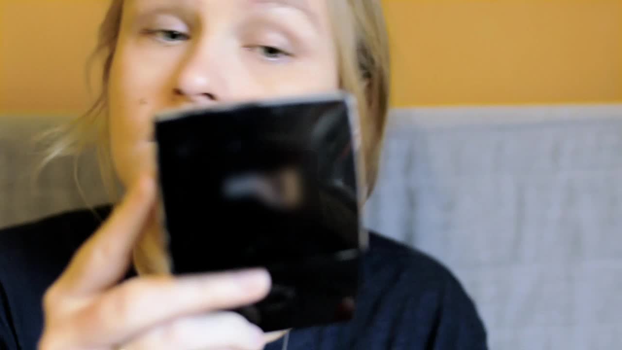 Stock Video Applying Makeup Using A Small Mirror Live Wallpaper For PC