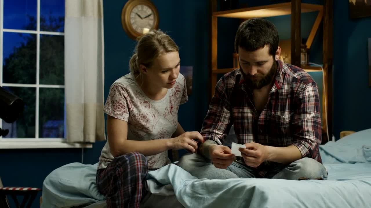 Stock Video Anguished Couple Checking The Bills In The Bedroom Live Wallpaper For PC