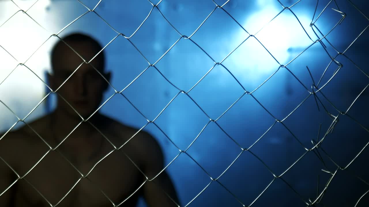 Stock Video Angry Shirtless Man Behind Wire Fence Live Wallpaper For PC