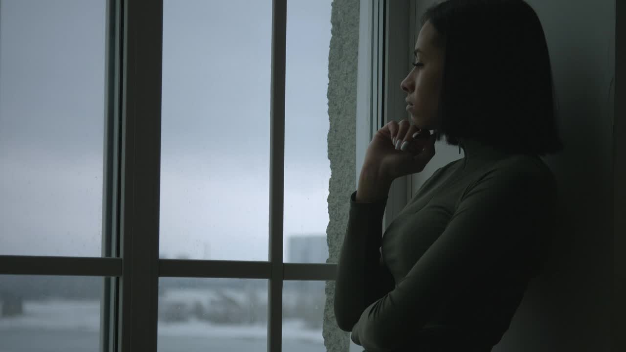 Stock Video An Upset Young Woman By The Window Live Wallpaper For PC