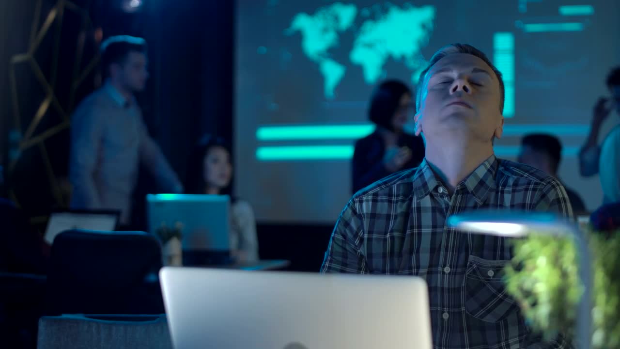 Stock Video An Exhausted Man At Work Close His Laptop Live Wallpaper For PC