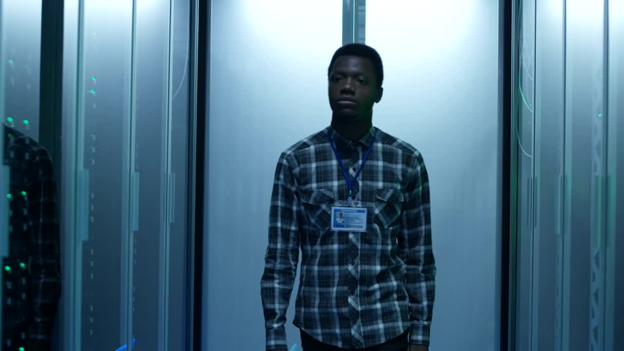 Stock Video An Engineer Arrives To The Computer In Data Center Live Wallpaper For PC