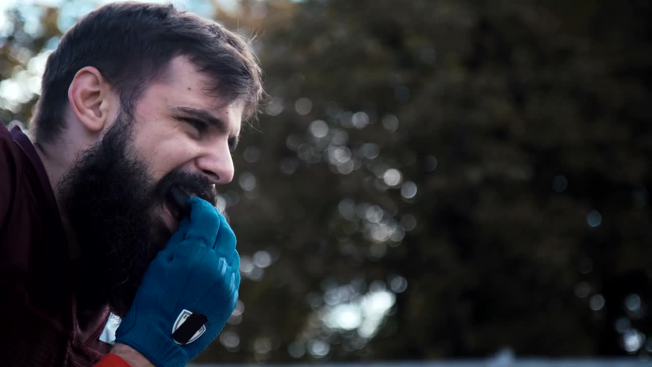 Stock Video American Footballer Putting A Helmet On Live Wallpaper For PC