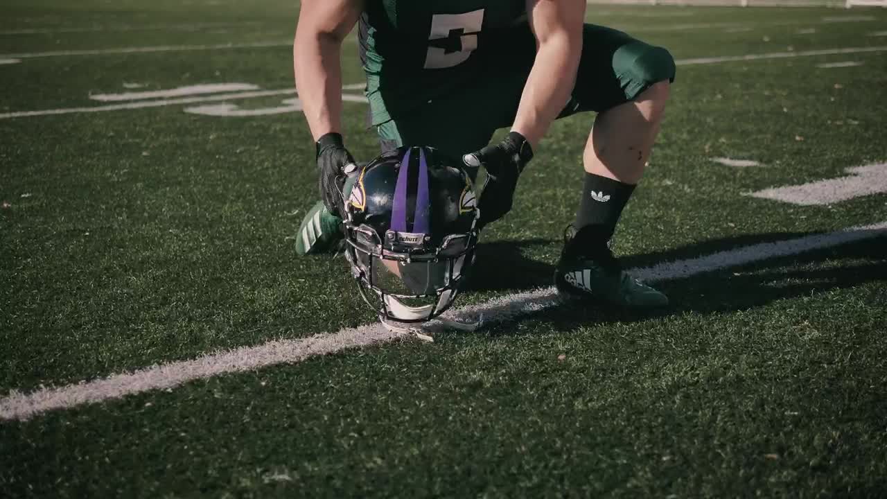 Stock Video Amateur Football Player Putting On His Helmet Live Wallpaper For PC
