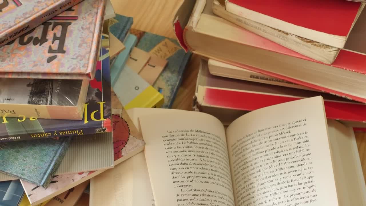 Stock Video All Kinds Of Books Stacked On A Table Seen Up Live Wallpaper For PC