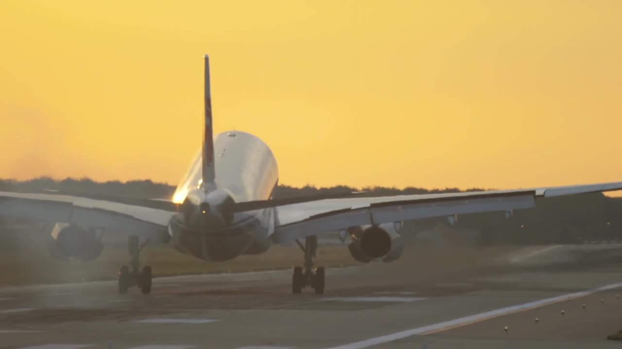 Stock Video Airplane Landing In Slow Motion In A Yellow Sky Live Wallpaper For PC