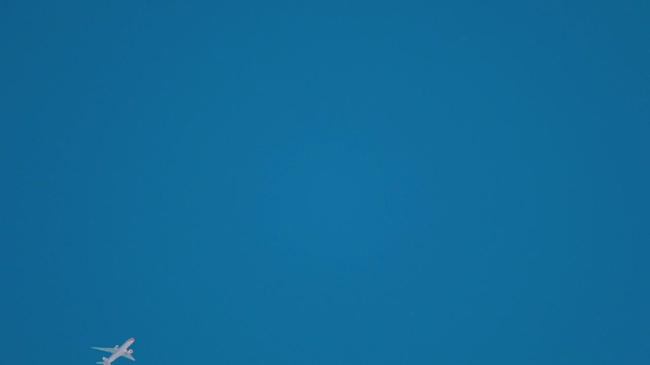 Stock Video Airplane Crossing The Clear Blue Sky Live Wallpaper For PC