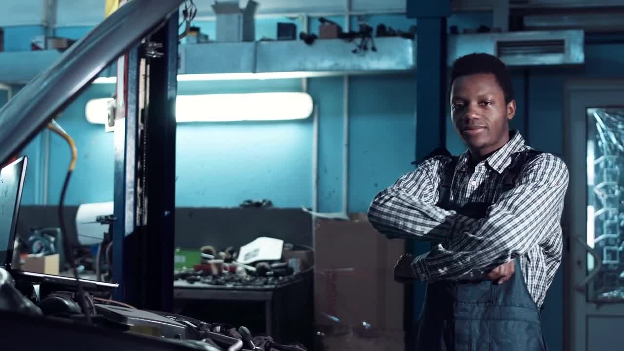 Stock Video A Young Mechanic Posing For The Camera Live Wallpaper For PC