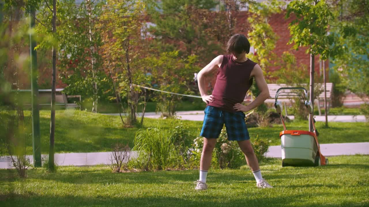 Stock Video A Young Man Warming Up In The Park Live Wallpaper For PC