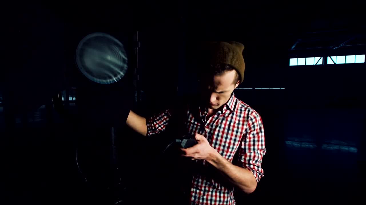 Stock Video A Young Man Turns On A Studio Light Live Wallpaper For PC