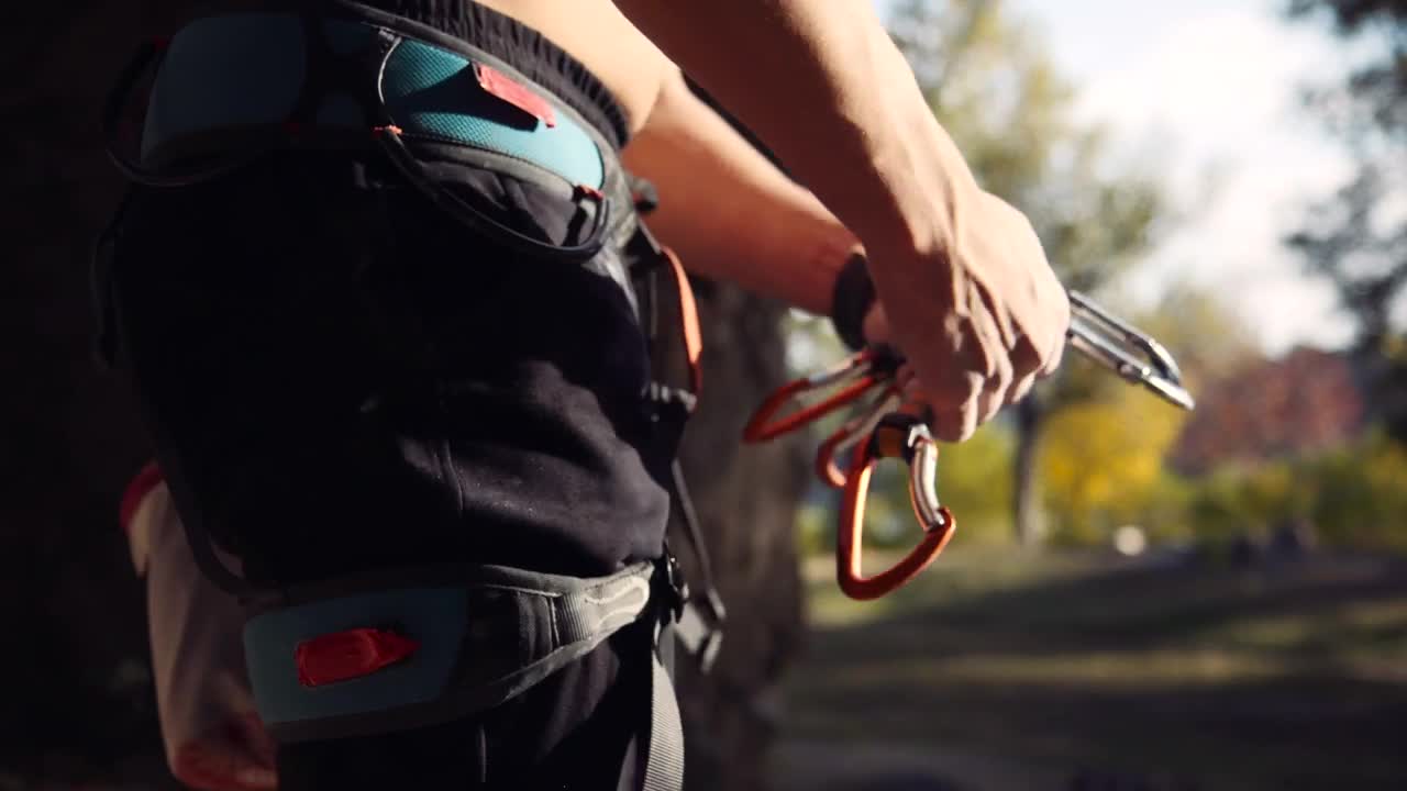 Stock Video A Young Man Preparing The Climbing Gear Live Wallpaper For PC