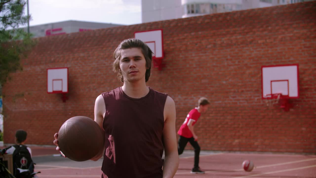 Stock Video A Young Man On The Basketball Court Bouncing The Ball Live Wallpaper For PC