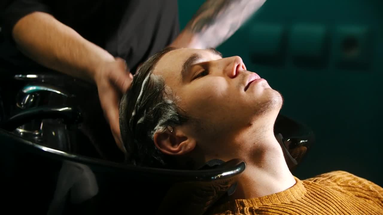 Stock Video A Young Man Having His Hair Washed With Shampoo In Live Wallpaper For PC