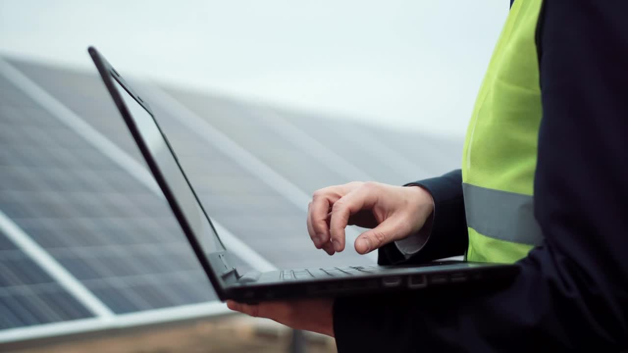 Stock Video A Worker With A Laptop Or On A Solar Panel Live Wallpaper For PC