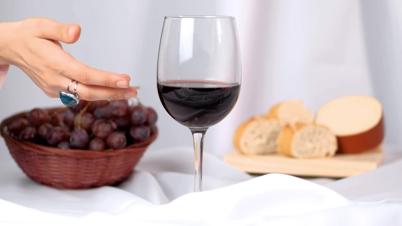 Stock Video A Womans Hand Takes A Glass Of Wine From An Live Wallpaper For PC