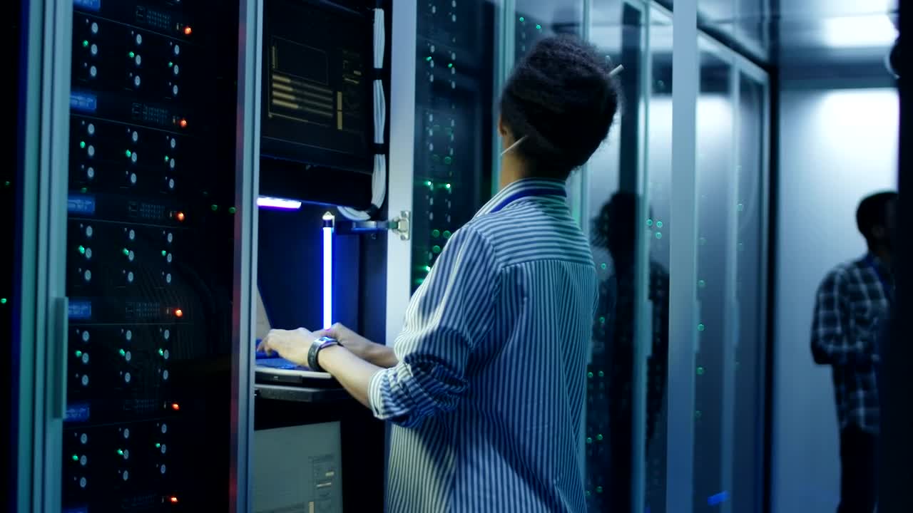 Stock Video A Woman Working With A Computer In The Server Room Live Wallpaper For PC