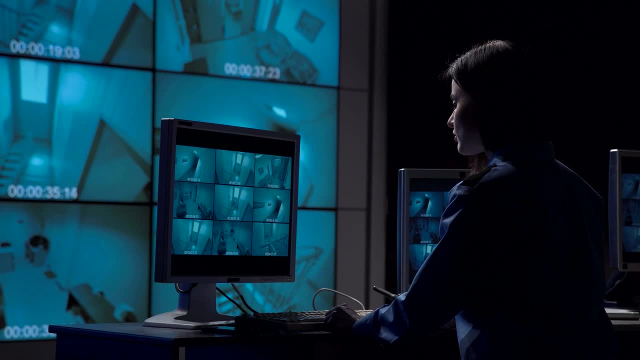 Stock Video A Woman Working On The Security Camera Room Live Wallpaper For PC
