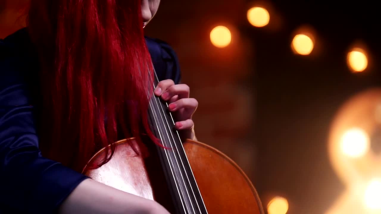 Stock Video A Woman With Red Hair Plays The Cello Live Wallpaper For PC
