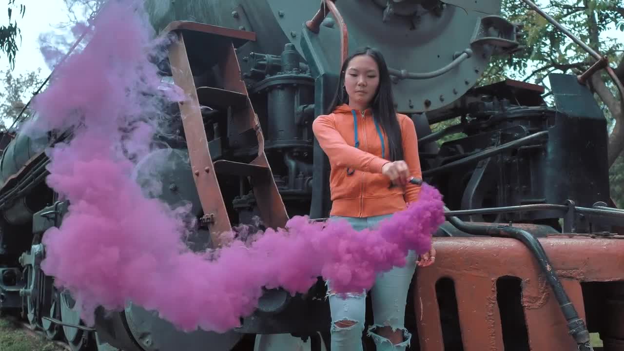 Stock Video A Woman Waving A Smoke Bomb On A Train Live Wallpaper For PC