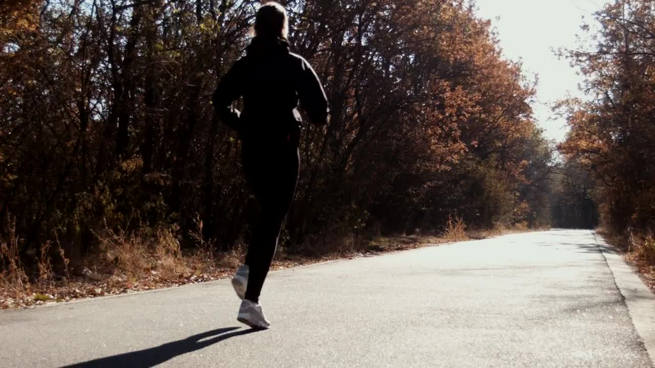 Stock Video A Woman Running On A Path In Autumn Live Wallpaper For PC