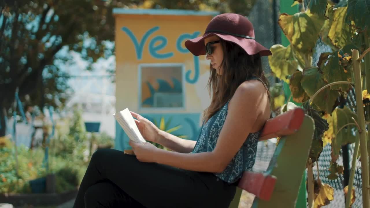Stock Video A Woman Reading A Book Outdoors Live Wallpaper For PC